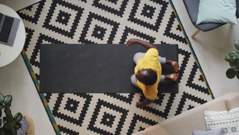 Afro-American-Man-Stretching-at-Home